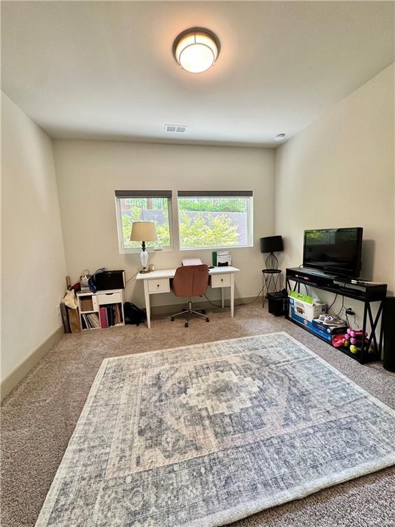 1153 Reynolds Square Ln # 16, Atlanta, GA 30307 - home office featuring carpet floors and baseboards