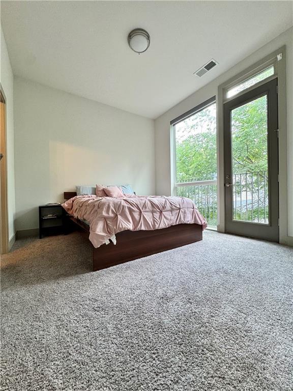 1153 Reynolds Square Ln # 16, Atlanta, GA 30307 - carpeted bedroom with access to exterior