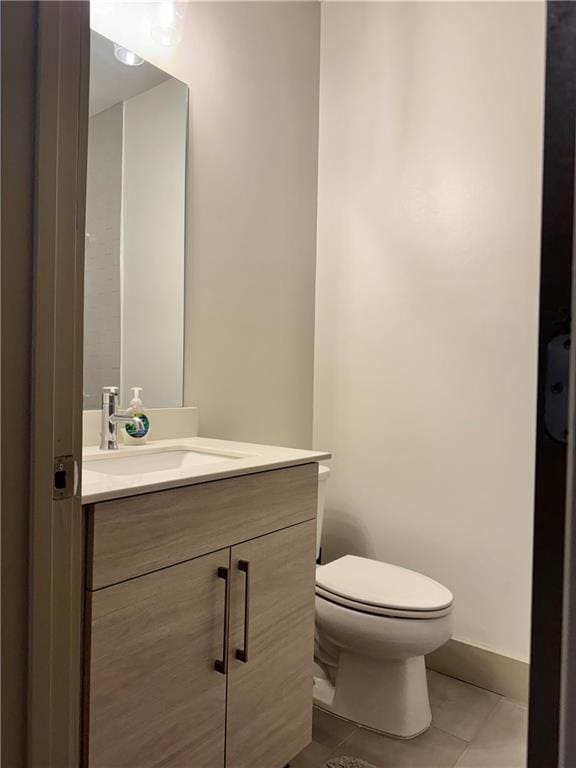 1153 Reynolds Square Ln # 16, Atlanta, GA 30307 - half bathroom featuring tile patterned flooring, vanity, and toilet