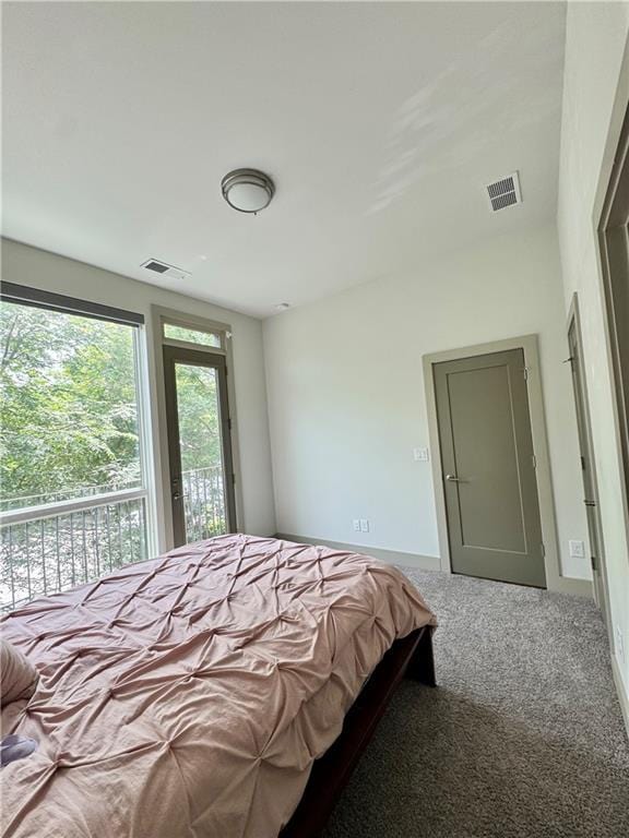1153 Reynolds Square Ln # 16, Atlanta, GA 30307 - carpeted bedroom with baseboards and access to exterior