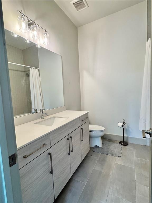 1153 Reynolds Square Ln # 16, Atlanta, GA 30307 - bathroom featuring toilet, vanity, and a shower with shower curtain