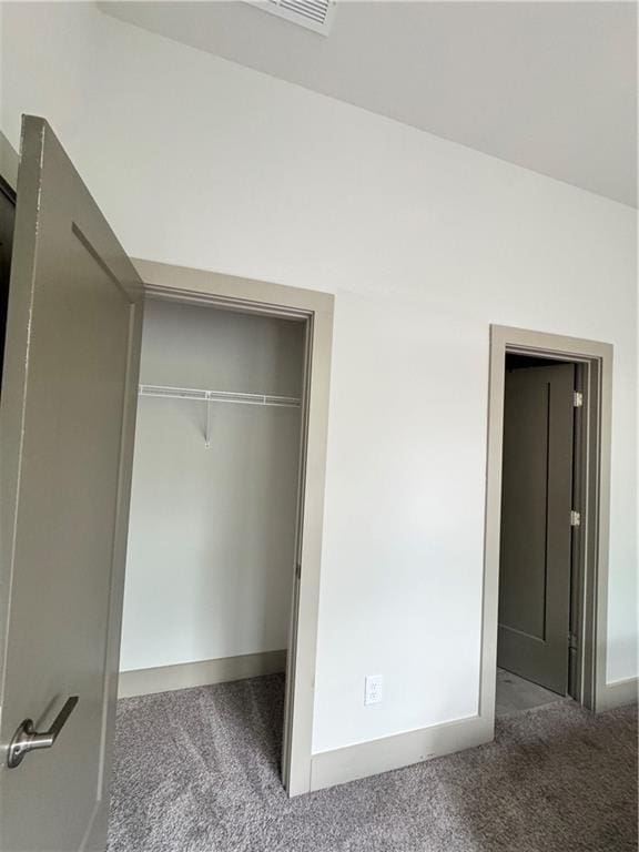 1153 Reynolds Square Ln # 16, Atlanta, GA 30307 - unfurnished bedroom featuring carpet, a closet, and baseboards