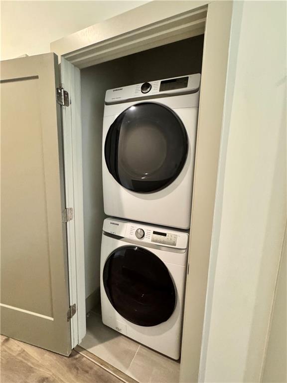 1153 Reynolds Square Ln # 16, Atlanta, GA 30307 - washroom with stacked washer / dryer