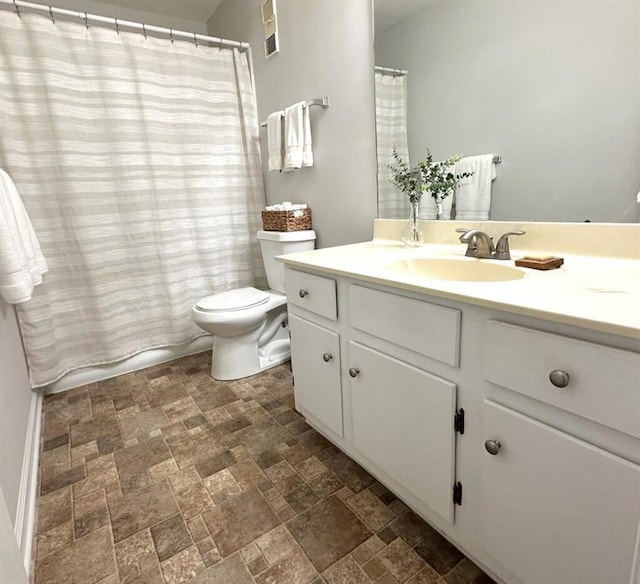 1507 Wynnes Ridge Cir SE, Marietta, GA 30067 - full bath with stone finish floors, vanity, and toilet