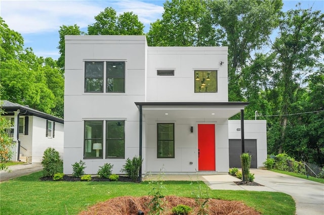 2926 5th St SW, Atlanta, GA 30315 - contemporary house featuring concrete driveway, stucco siding, and a front yard