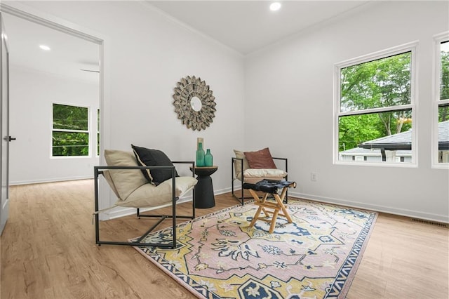 2926 5th St SW, Atlanta, GA 30315 - sitting room with healthy amount of natural light, ornamental molding, wood finished floors, recessed lighting, and baseboards