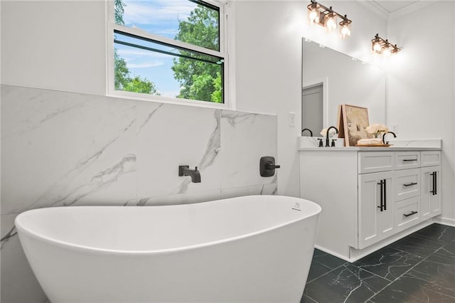 2926 5th St SW, Atlanta, GA 30315 - full bath featuring marble look tiles, tile walls, double vanity, a freestanding bath, and crown molding
