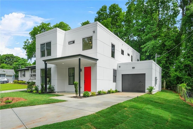 2926 5th St SW, Atlanta, GA 30315 - contemporary home featuring a front yard, driveway, stucco siding, and a garage