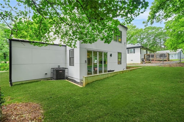 2926 5th St SW, Atlanta, GA 30315 - back of property featuring cooling unit and a lawn