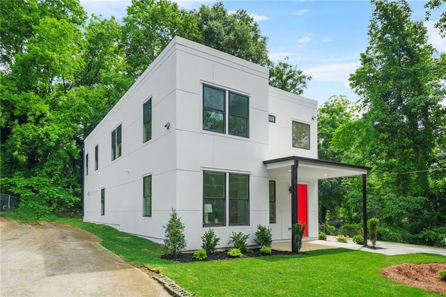 2926 5th St SW, Atlanta, GA 30315 - contemporary house featuring a front lawn and stucco siding