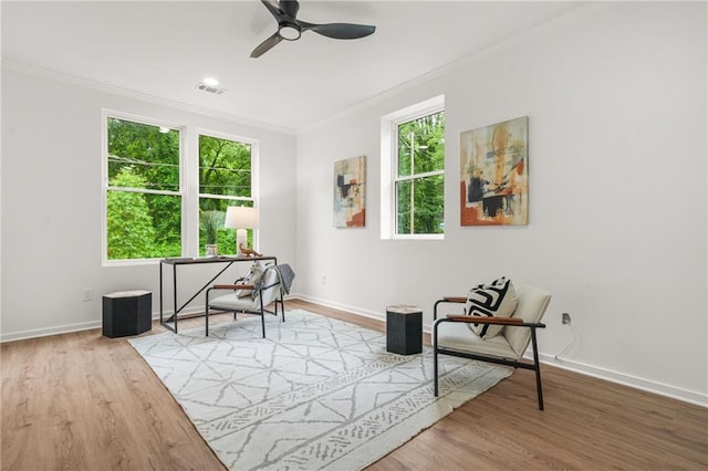 2926 5th St SW, Atlanta, GA 30315 - living area with crown molding, ceiling fan, wood finished floors, and baseboards
