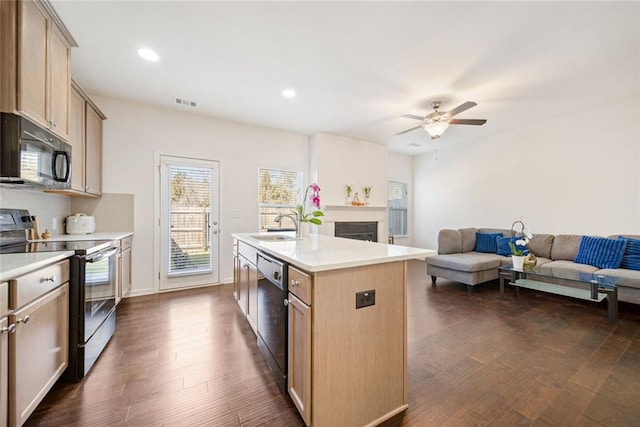 kitchen with black microwave, dishwashing machine, dark wood-style flooring, a sink, and electric stove