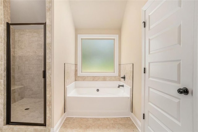381 Homestead Cir, Forsyth, GA 31029 - bathroom featuring a garden tub, a shower stall, and tile patterned flooring