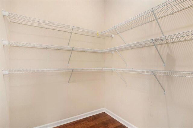 381 Homestead Cir, Forsyth, GA 31029 - walk in closet featuring dark wood-type flooring