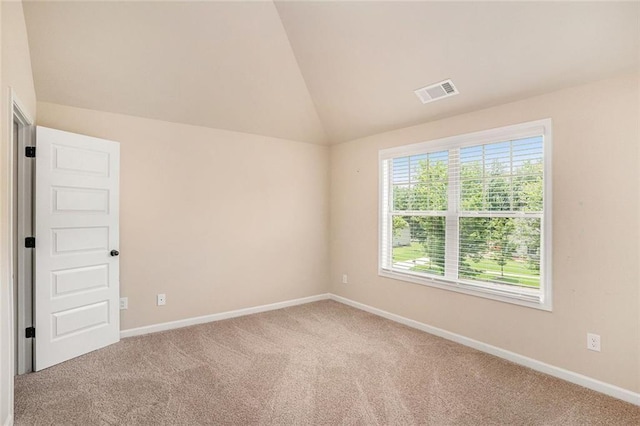 381 Homestead Cir, Forsyth, GA 31029 - spare room featuring carpet and lofted ceiling