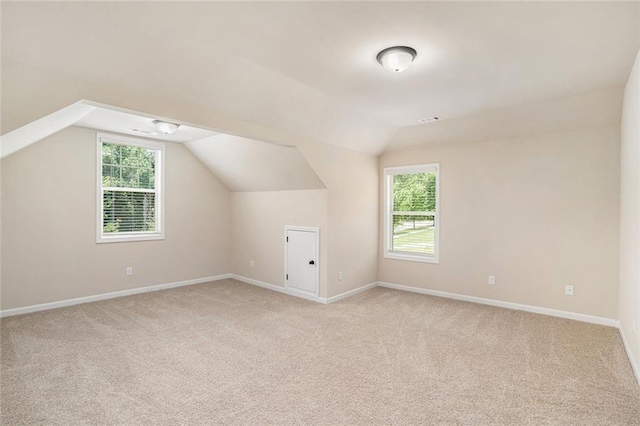 381 Homestead Cir, Forsyth, GA 31029 - bonus room featuring light colored carpet, plenty of natural light, and lofted ceiling