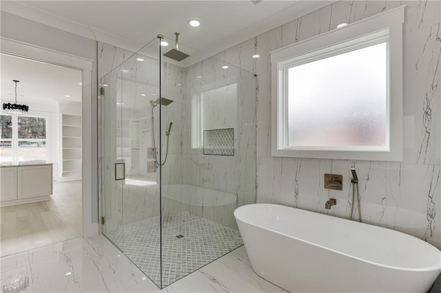 bathroom featuring separate shower and tub