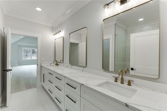 bathroom with vanity, tile patterned floors, and ornamental molding