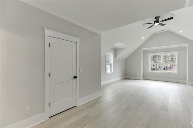 additional living space featuring vaulted ceiling, light hardwood / wood-style floors, and ceiling fan