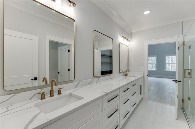 bathroom featuring vanity, tile patterned floors, and ornamental molding