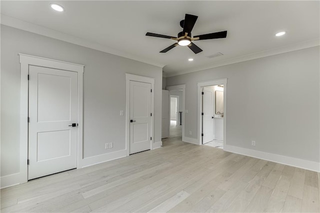 unfurnished bedroom featuring ceiling fan, ensuite bath, ornamental molding, and light hardwood / wood-style floors