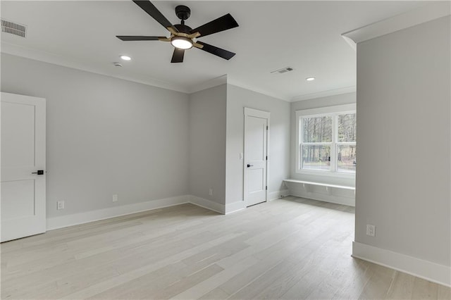 unfurnished bedroom featuring light hardwood / wood-style flooring, ornamental molding, and ceiling fan