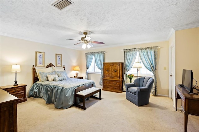 carpeted bedroom featuring multiple windows, a textured ceiling, ceiling fan, and ornamental molding