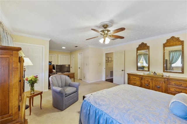 bedroom featuring ceiling fan, light colored carpet, and crown molding