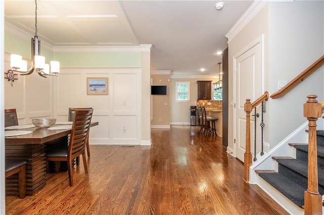 2025 Eagle Rdg, Roswell, GA 30076 - dining space with a chandelier, crown molding, stairs, dark wood-style floors, and a decorative wall