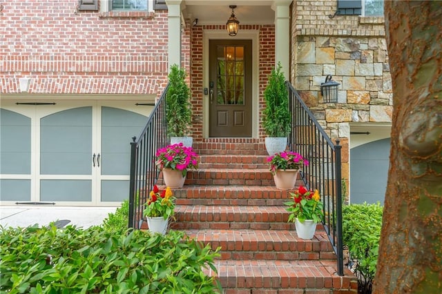 2025 Eagle Rdg, Roswell, GA 30076 - view of exterior entry featuring brick siding, stone siding, and a garage