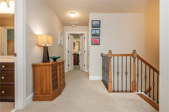 2025 Eagle Rdg, Roswell, GA 30076 - hallway with an upstairs landing, carpet floors, and baseboards