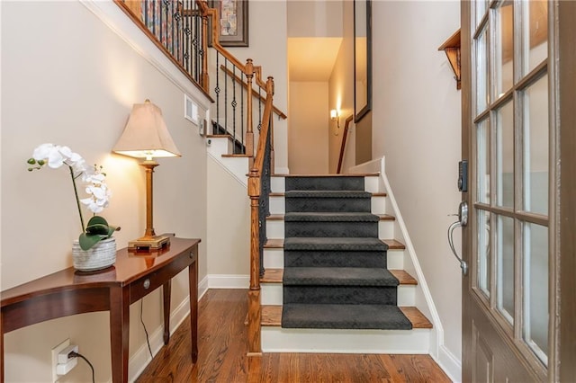 2025 Eagle Rdg, Roswell, GA 30076 - stairs featuring wood finished floors, a towering ceiling, and baseboards