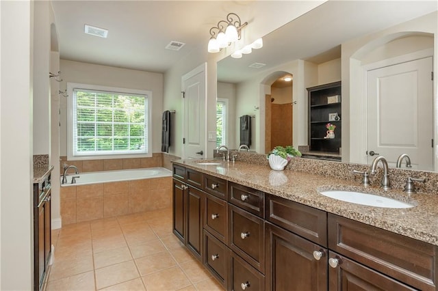 2025 Eagle Rdg, Roswell, GA 30076 - bathroom featuring double vanity, plenty of natural light, tile patterned floors, and a bath