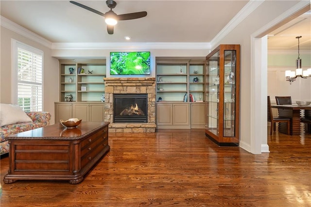 2025 Eagle Rdg, Roswell, GA 30076 - living area featuring a ceiling fan, a stone fireplace, dark wood finished floors, crown molding, and a chandelier
