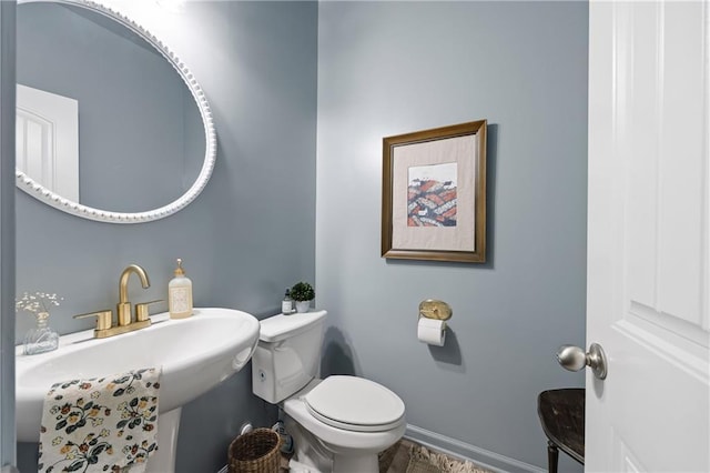 1417 Woodrow Kay Rd, Rockmart, GA 30153 - half bathroom featuring toilet, a sink, and baseboards