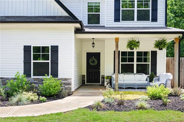 1417 Woodrow Kay Rd, Rockmart, GA 30153 - view of exterior entry featuring covered porch, an outdoor hangout area, and stone siding