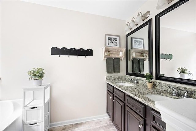 1417 Woodrow Kay Rd, Rockmart, GA 30153 - full bath featuring double vanity, a bath, baseboards, and wood finished floors