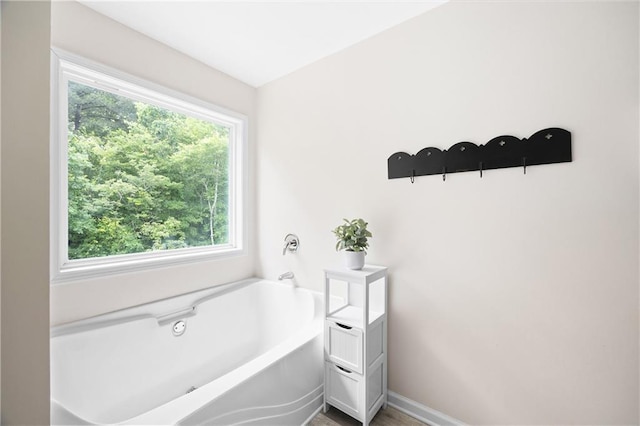 1417 Woodrow Kay Rd, Rockmart, GA 30153 - full bathroom featuring a garden tub and baseboards