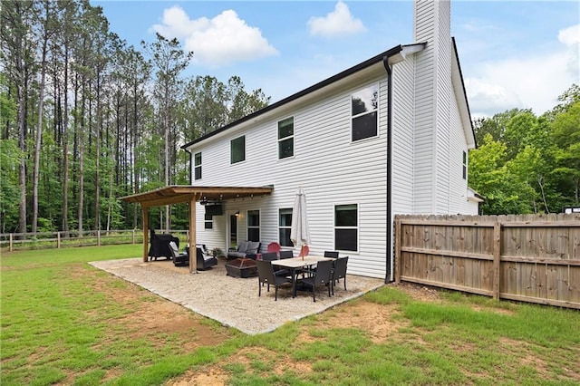 1417 Woodrow Kay Rd, Rockmart, GA 30153 - rear view of house with a patio area, an outdoor hangout area, and a chimney