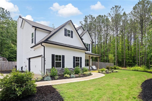 1417 Woodrow Kay Rd, Rockmart, GA 30153 - view of side of home featuring board and batten siding, a garage, a chimney, and stone siding