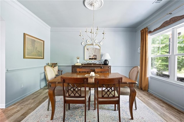 1417 Woodrow Kay Rd, Rockmart, GA 30153 - dining space with light wood-style flooring, baseboards, a chandelier, and ornamental molding