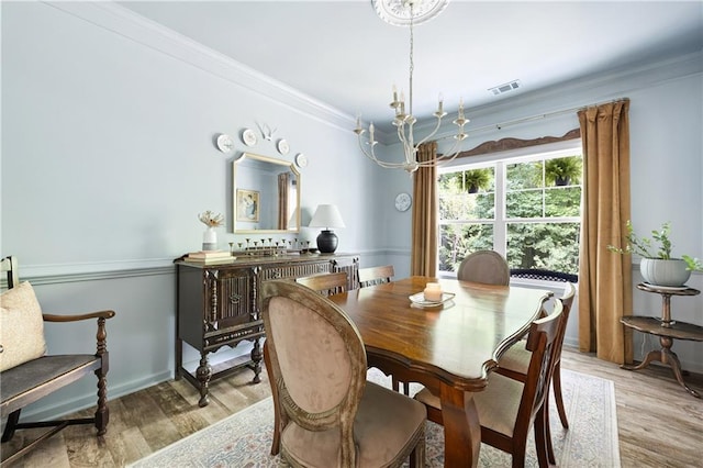 1417 Woodrow Kay Rd, Rockmart, GA 30153 - dining area with a chandelier, light wood-type flooring, and ornamental molding