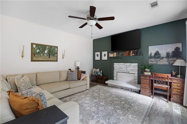 1417 Woodrow Kay Rd, Rockmart, GA 30153 - living room featuring a ceiling fan, a fireplace, and wood finished floors