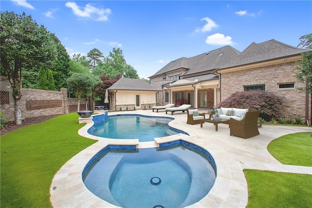 view of pool featuring an in ground hot tub, outdoor lounge area, a patio, and a lawn