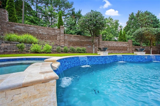 view of pool with pool water feature