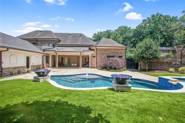 view of pool featuring a yard and a patio area