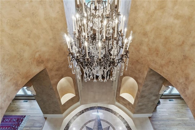 room details featuring hardwood / wood-style flooring and a notable chandelier