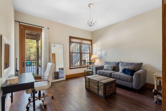 interior space with dark wood-type flooring and an inviting chandelier