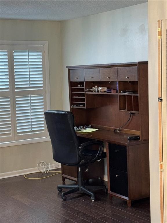 office area featuring a textured ceiling, baseboards, and dark wood-style flooring