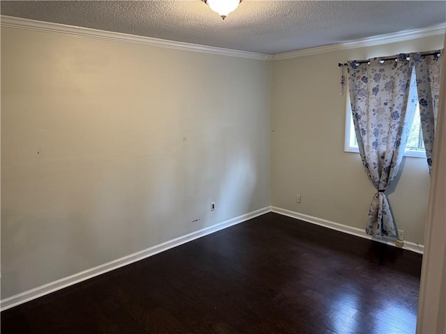 unfurnished room with baseboards, a textured ceiling, dark wood-style flooring, and crown molding